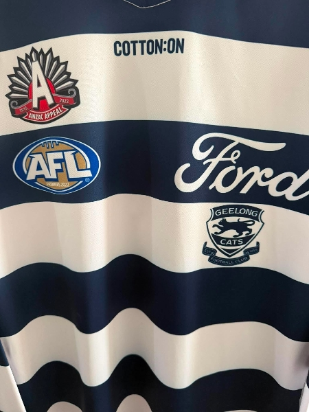 Geelong Cats 2023 AFL ANZAC long sleeve jersey by Cotton On featuring team logo and official design.