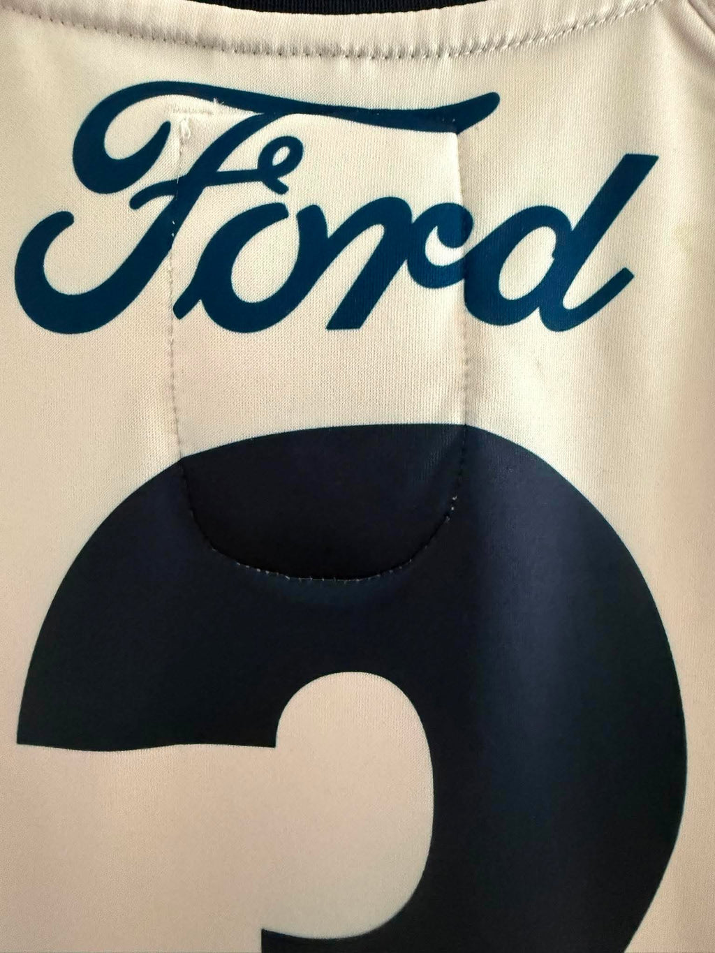 Long sleeve Geelong Cats 2023 AFL ANZAC player issue jersey by Cotton On, featuring team logo and official design details.