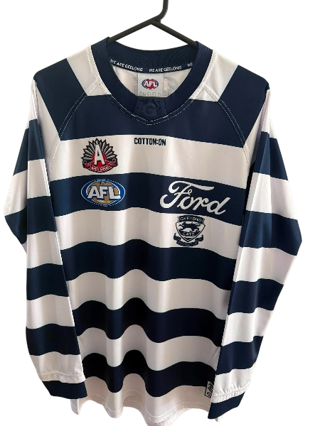 Long sleeve Geelong Cats 2023 AFL ANZAC player issue jersey by Cotton On, featuring team logo and official design details.